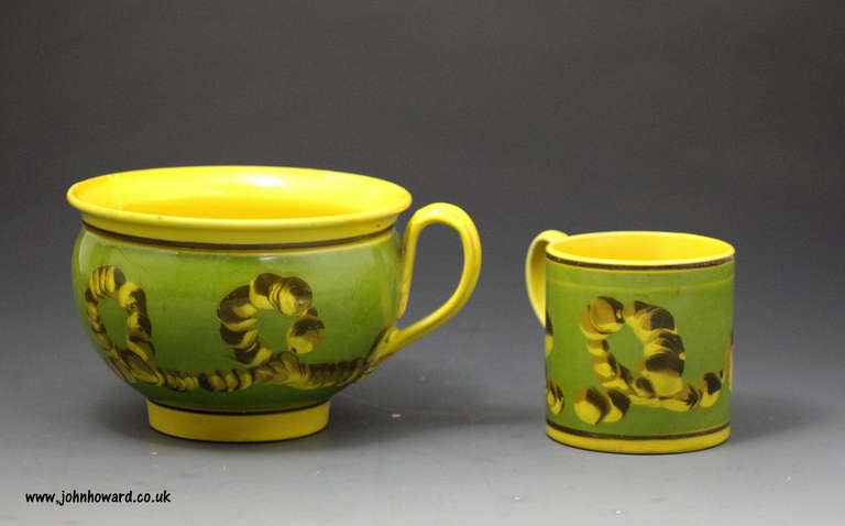 Two pieces of antique mochaware pottery decorated in the classic earthworm pattern on a green border applied over a canary yellow ground. These rare pieces in yellow would date to the beginning of the 19th century. These distinctive wares in mocha