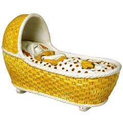 Prattware pottery baby in cradle early 19th century . Used Prattware pottery baby in cradle early 19th century .