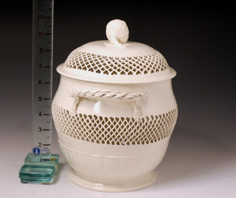 Antique 18th century creamware pottery jar and cover with reticulated decoration probably from the Leeds Pottery England.
This piece is a very rare form in plain undecorated creamware.
The size is deceptively large. 