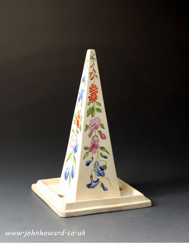 A rare and fine Jelly Core from Josiah Wedgwood Englands master pottery.
The body is a fine creamware with beautifully hand decorated flowers on the obelisk shape core. This shape is a rare Wedgwood shape and has the quality one would expect from