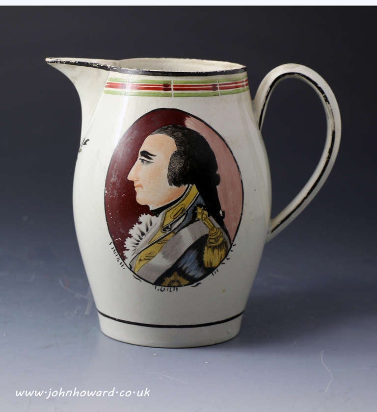 A rare commemorative pearlware glazed pottery pitcher with a good and unusual hand painted image in enamels colours of Admiral Lord Duncan.