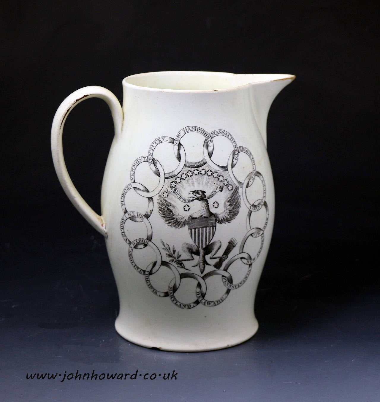 Antique English pottery creamware pitcher with emblems for 15 American states, the reverse a print with overpainted enamel colours of a sailing ship with the American flag c1800 
The pitcher is probably Liverpool Pottery.