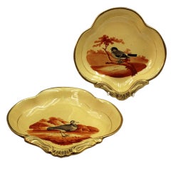 Pair of English pottery dessert shaped dishes with images of birds c1815