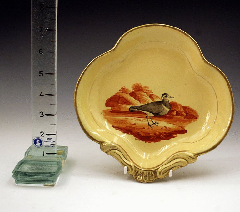 Pair of English pottery dessert shaped dishes with images of birds c1815