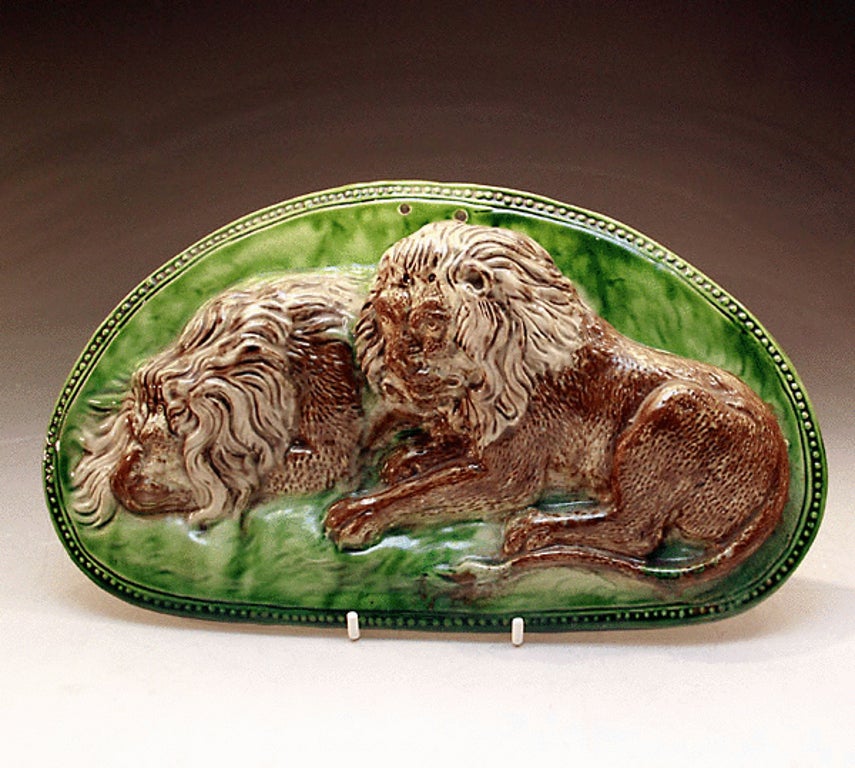 Staffordshire pottery Ralph Wood plaque with figures of two resting lions