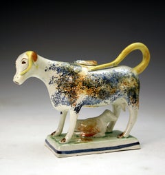 English pottery figure of a cow creamware with calf c1800 