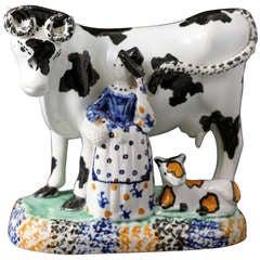 Antique English pottery figure of a cow with milkmaid. Yorkshire pottery c1815