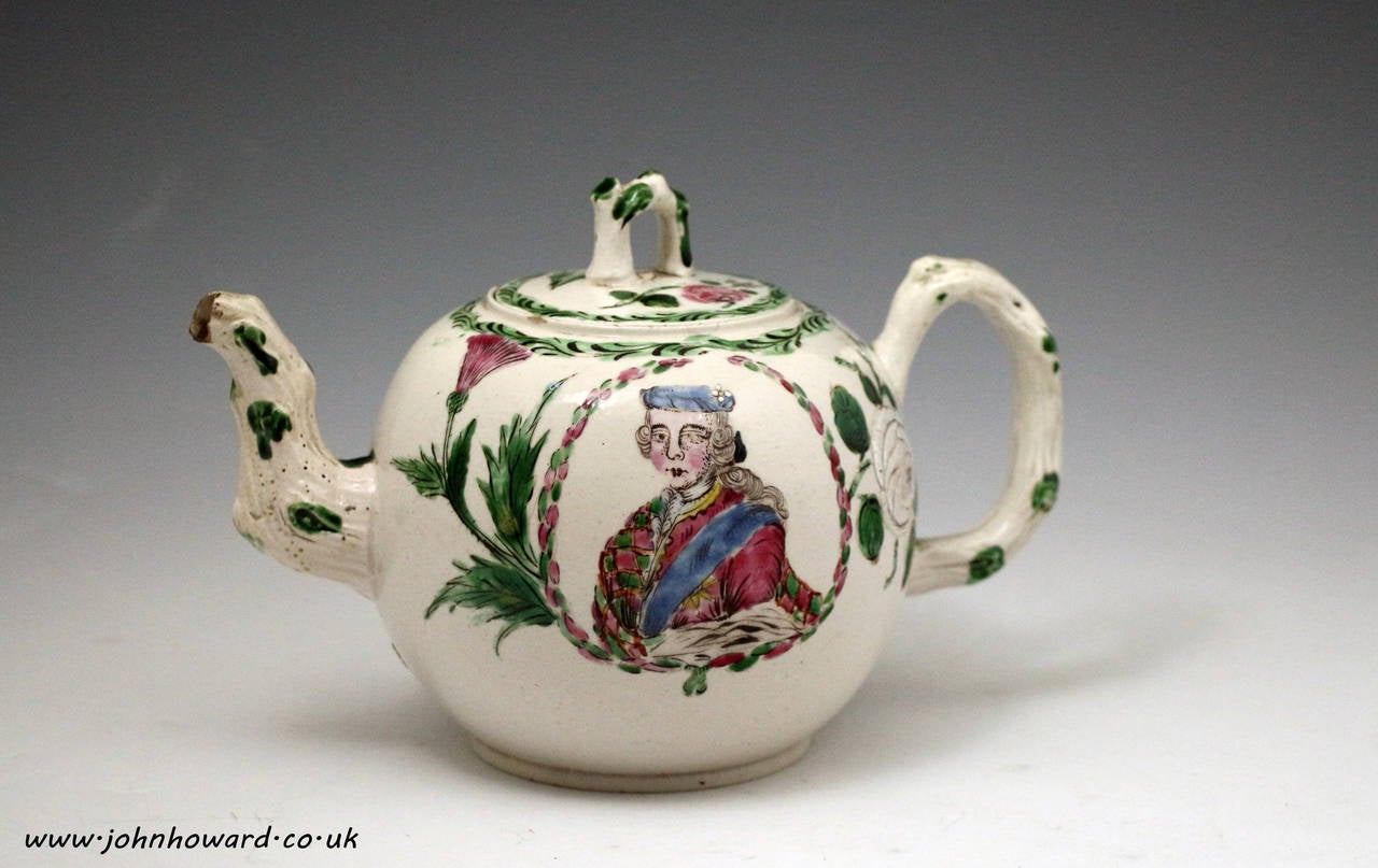 An exceptionally rare Jacobite related Staffordshire stoneware salt glazed teapot with enamels. 
The teapot is decorated with a portrait of Bonnie Prince Charlie in a cartouche bordered with a thistle and white rose. The piece would date from the