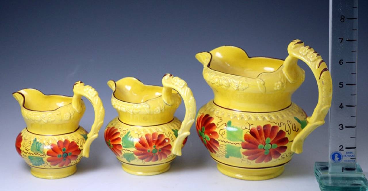 English Set of Three Antique Staffordshire Pottery Canary-Yellow Pitchers