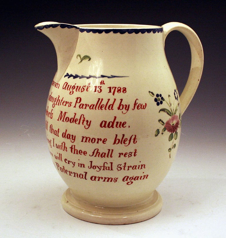 Early English creamware pottery pitcher. The pitcher is named and dated 