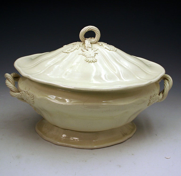 A good English creamware pottery undecorated creamware turen and cover in the classic silver shape. The tureen and cover have good decorative and unrestored handles. 

Staffordshire or Yorkshire.