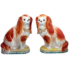 Used Pair Of Staffordshire Pottery Spaniels With Glass Eyes Sitting On Cushion Base