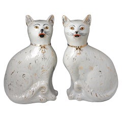 Antique pottery figures of seated cats Victorian period. 