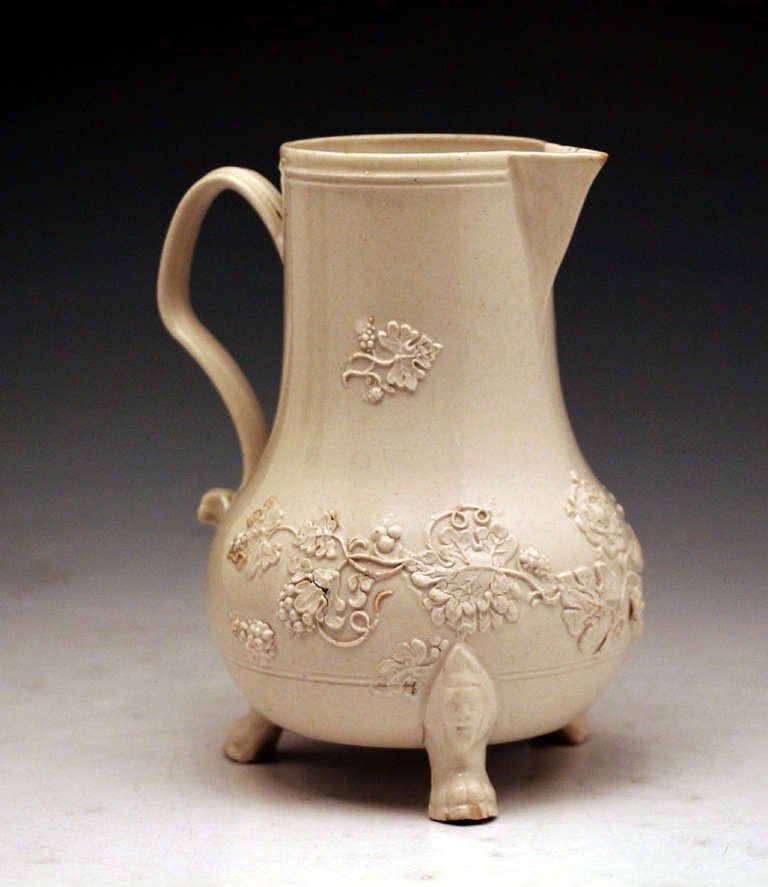 A fine antique early English pottery water jug in saltglaze stoneware.
The jug is very finely potted and is decorated with applied trailing leaves,stems and flowers. It is a classic piece from the mid 18th century , the early pioneering days of the