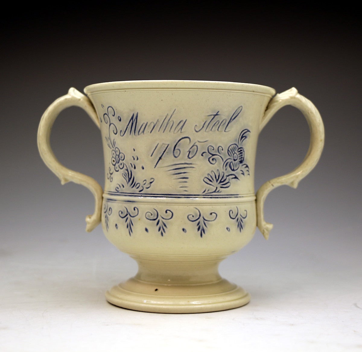 Scratch blue saltglaze pottery loving cup named and dated 1765