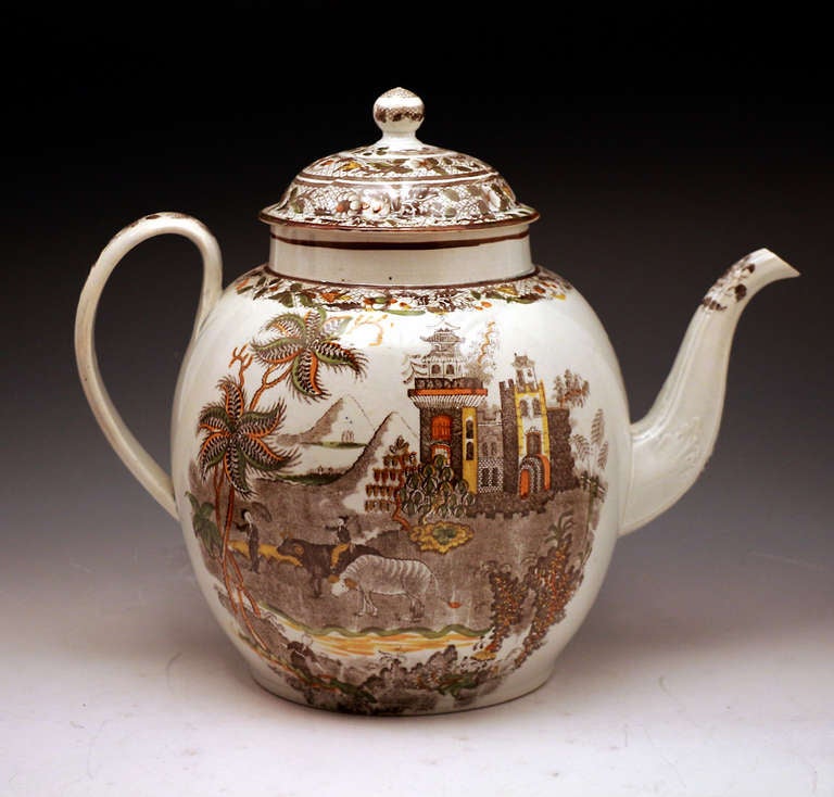 A massive pearl ware punch pot decorated with an underglaze transfer print of a boy with two rams in a chinoserie landscape. The transfer is decorated in the Salopian pallette also underglaze. The scale of this pot is significant and is one of,if