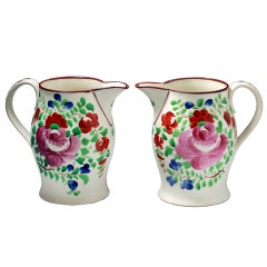 Antique Pair of pitchers with floral decoration attributed to Swansea Pottery Wales