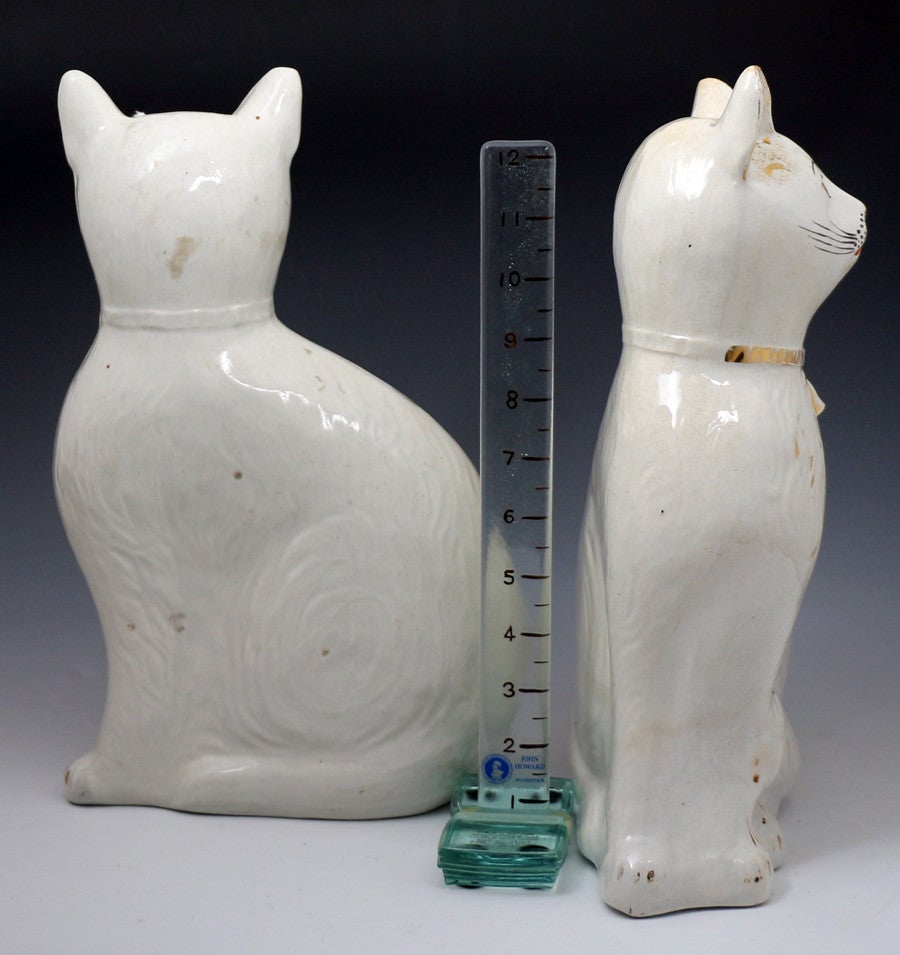 A fine and rare pair of white seated cats with gilt decoration produced by the Alloa Pottery, Scotland in the late 19th century.
The figures are exceptionally striking with a strong naive appeal.