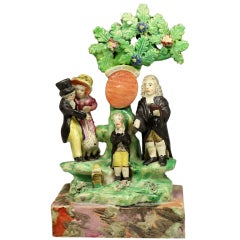 Staffordshire pottery figure group titled The Marraige Act. 