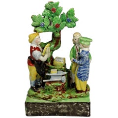 Staffordshire pottery figure group titled The Marraige Act.Circa 1823 
