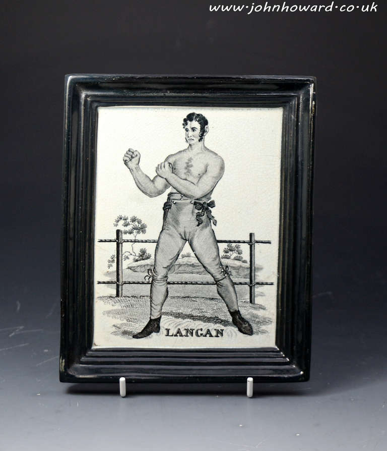 A rare antique English pottery commemorative plaque with an underglaze black and white transfer print of the famous Irish boxer Jack Langan. His fight with the English boxer Spring caused a sensation with their epic bare knuckle match staged in