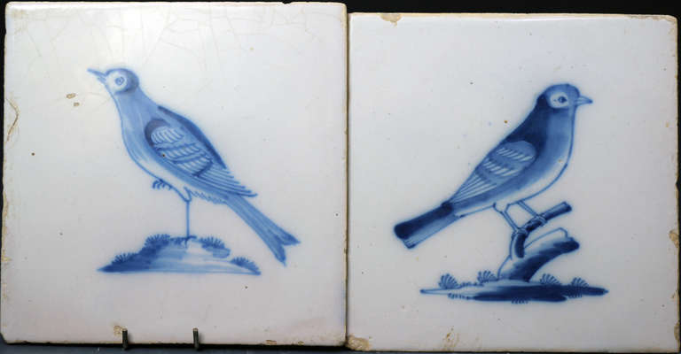 A pair of English delftware tiles decorated in cobalt blue with images of birds.
These mid 18th century delft pieces are both in fine condition.
