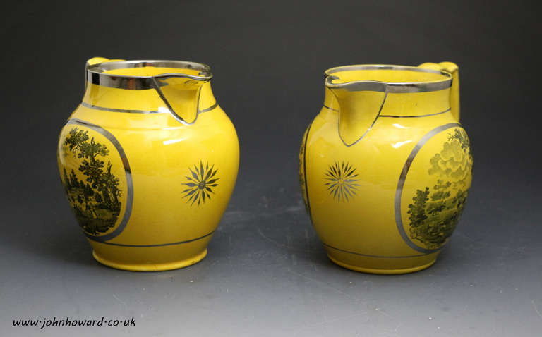 Pair of antique canary yellow pitcher with silver luster decoration with images of gentries country houses.

Pair of antique canary yellow pitchers with silver luster decoration with images of gentries country houses c1820.
This pair are in fine