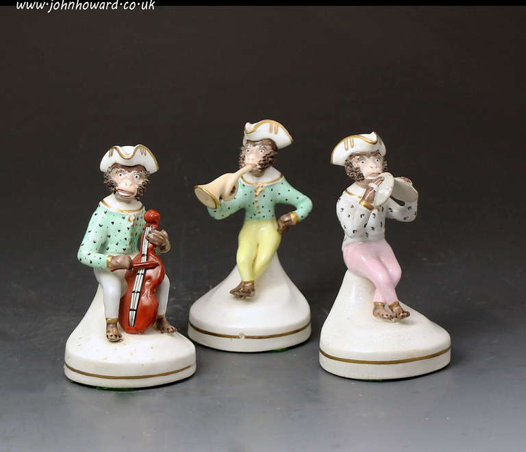 A rare trio of antique pottery Monkey Band figures dating to the c1840 period.
The figures are comically modeled playing a trumpet, cymbals and a cello.
The design of these figures originated at the Meissen Factory in Germany in the 18th century