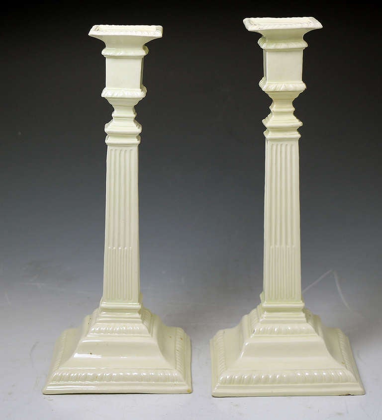 Antique plain undecorated creamware pottery pair of candlesticks.
A very stylish and elegant pair from the late 18th century.
Classical silver shape modelling, an iconic statement. 

Provenance: Private collection London England.