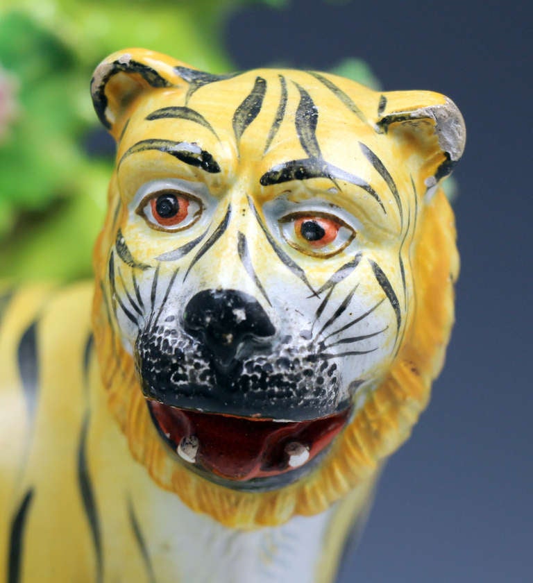 English Antique Staffordshire pottery figure of a tiger