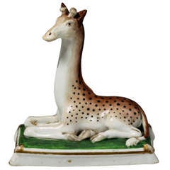 Antique Staffordshire porcelain figure of a seated Giraffe circa 1840
