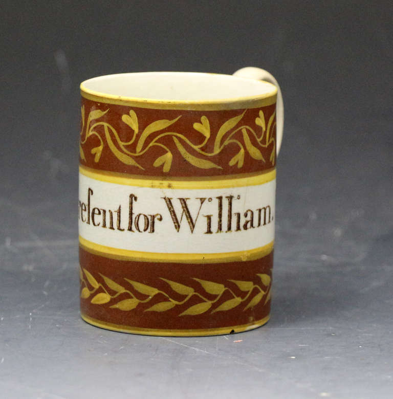 Antique creamware mug Present for William English pottery period late 18th century 

A fine antique creamware bodied mug finely decorated by hand with the inscription 