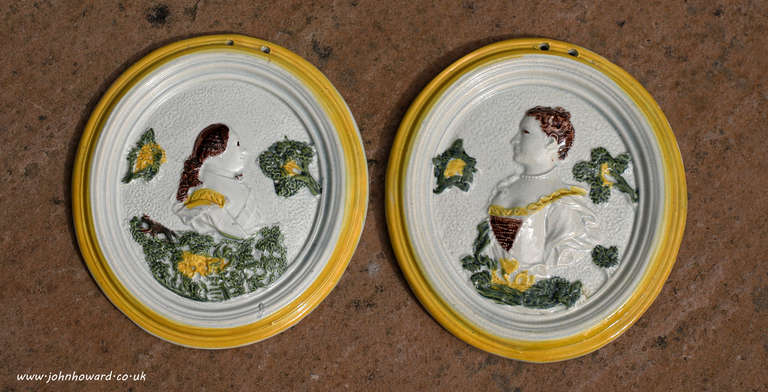Antique pottery prattware plaques commemorative King George 111 and Queen Charlotte 18th century English 

A rare pair of antique pottery prattware plaques with relief molded decoration of the heads of King George 111 and his Queen Charlotte. A