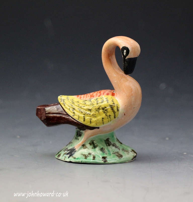 A fine antique Staffordshire pottery figure of a swan in the form of a whistle.
The figure is decorated with good enamel colours, a rare and interesting object with a pearlware glaze.