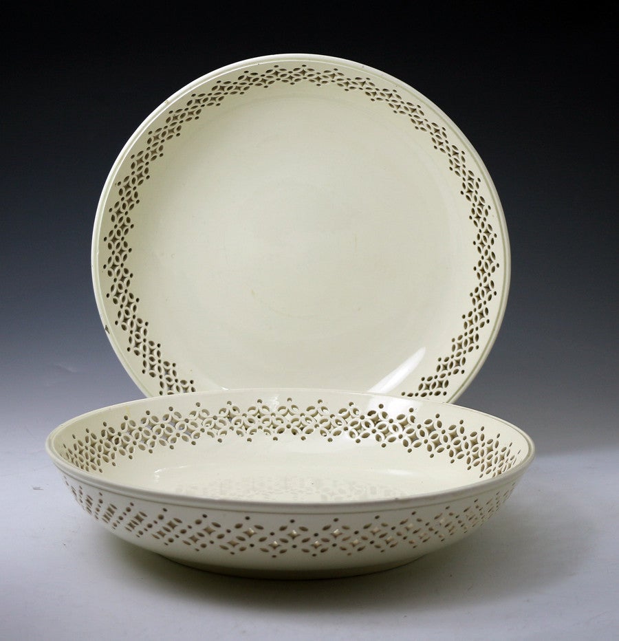 Pair of English plain undecorated creamware dishes with reticulated borders. 
The dishes are a good size with strong decorative impact.