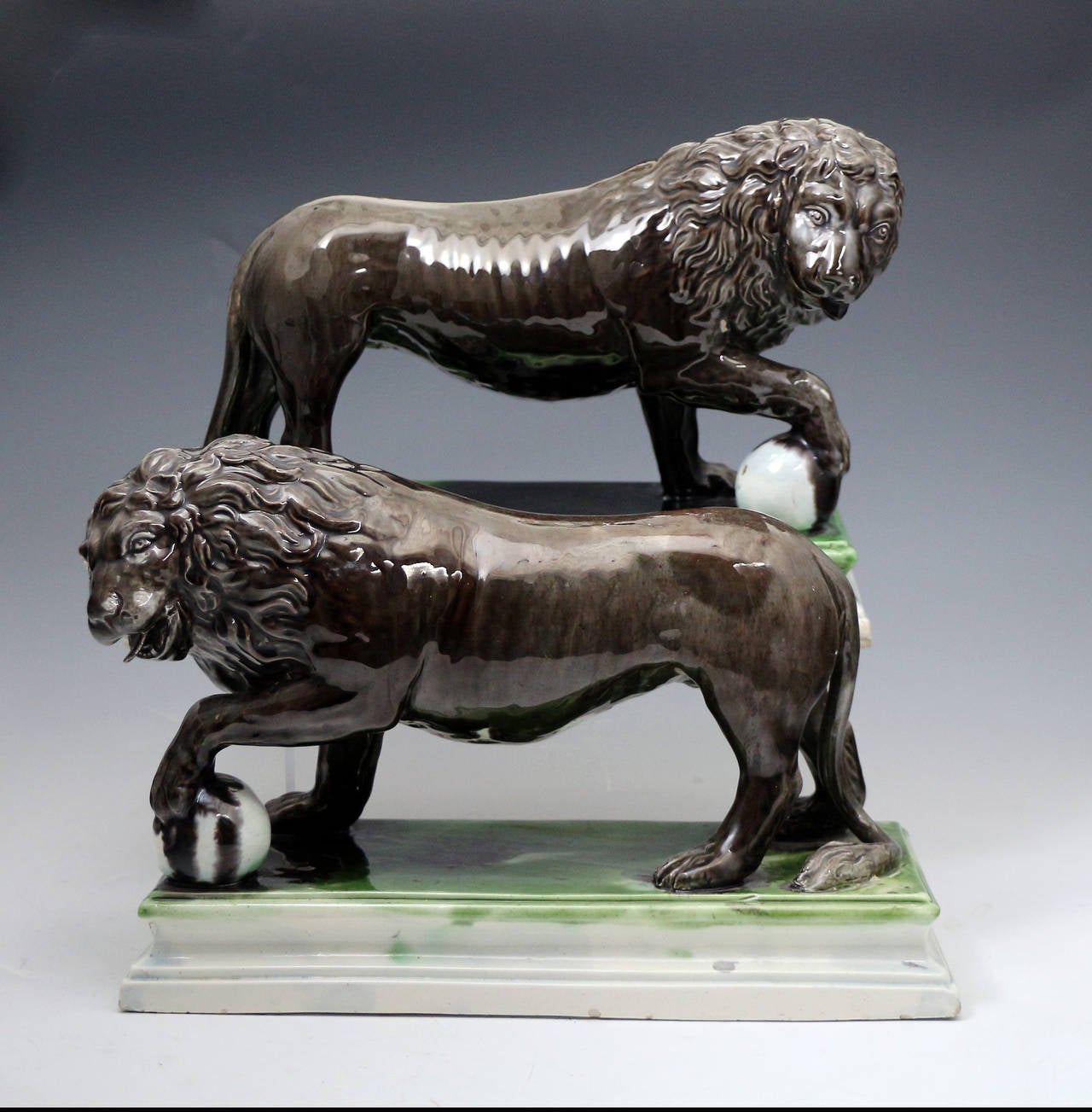 English Pair of Staffordshire Pottery Figures of Lions by Ralph Wood