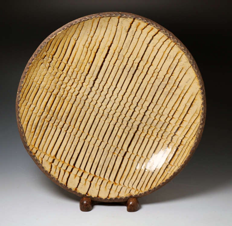 Early English comb decorated slipware earthenware circular dish late 18th century. 

Antique English earthenware slipware comb decorated circular dish with pie crust edge. 
Excellent glaze, good decoration, fine colour and the back of the piece