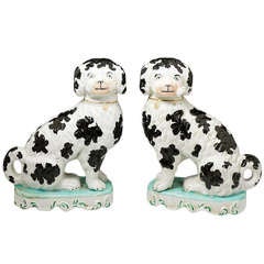 Pair Victorian Staffordshire pottery figures of dogs smoking pipes