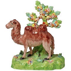 Antique Staffordshire pottery figure of a camel with fine flowered bocage c1815 