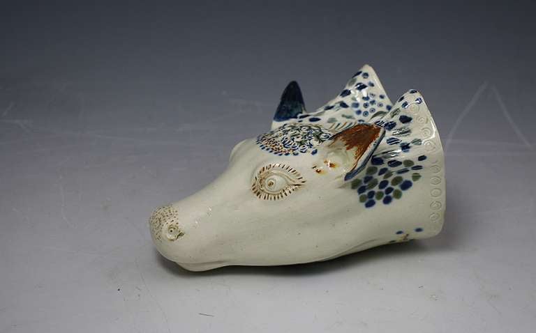 Antique English pottery prattware stirrup cup in the form a of a stags head. 
Stirrup cups are usually related to fox hunting, the cups associated with stag hunting are very rare. This stirrup cup is of special interest as it is decorated in Pratt