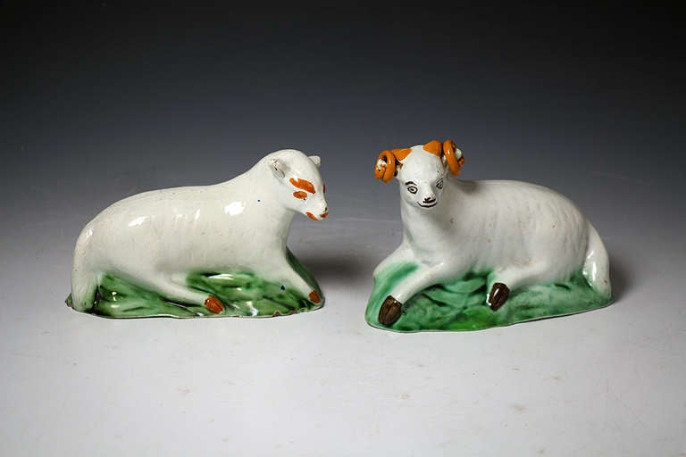 Antique pottery pair figures of a ram and ewe decorated in Pratt colors.
This pair of figures are the work of the Yorkshire Potteries.
They are naively molded and decorated which adds to the folk like charm.
This pair are rare and previously