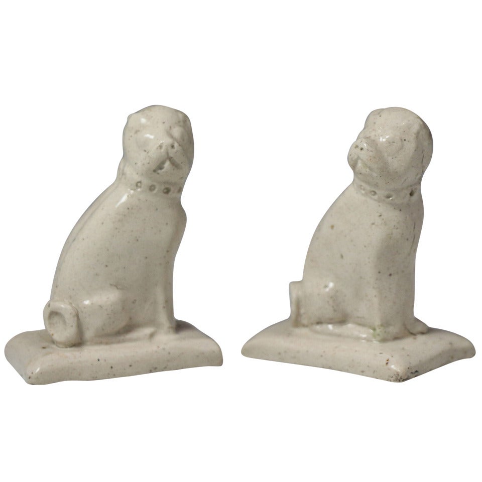 Rare pair of Staffordshire saltglaze pottery figures of pug dogs c1760