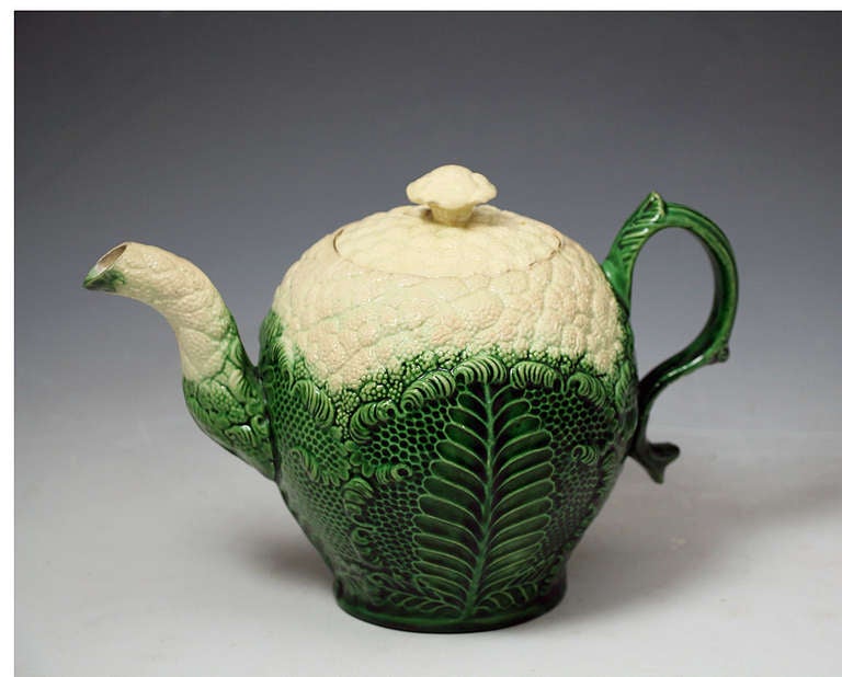 Antique English Staffordshire pottery teapot in the form of a cauliflower c1765. 
The teapot probably by William Greatbach/ Josiah Wedgwood. 
The relief moulded decoration is well defined with a fine lead glaze. 

Provenance: Private USA