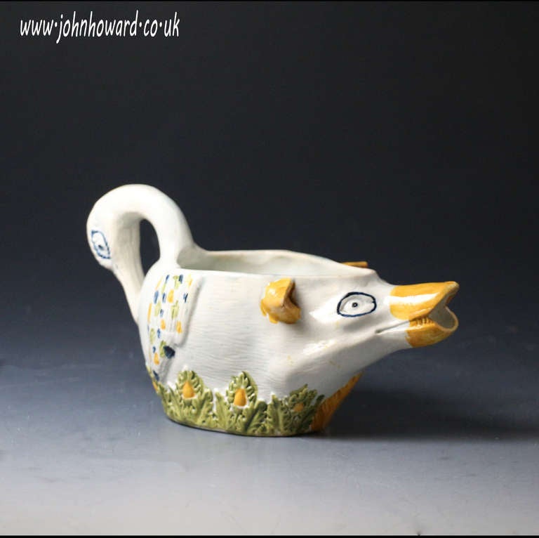 Antique English pottery Prattware sauce boat early 19th century, Staffordshire or Yorkshire Pottery. 

A rare English pottery pratt coloured sauce boat in the form of a swan at the tail and a boar at the head.
This bizarre combination of figures