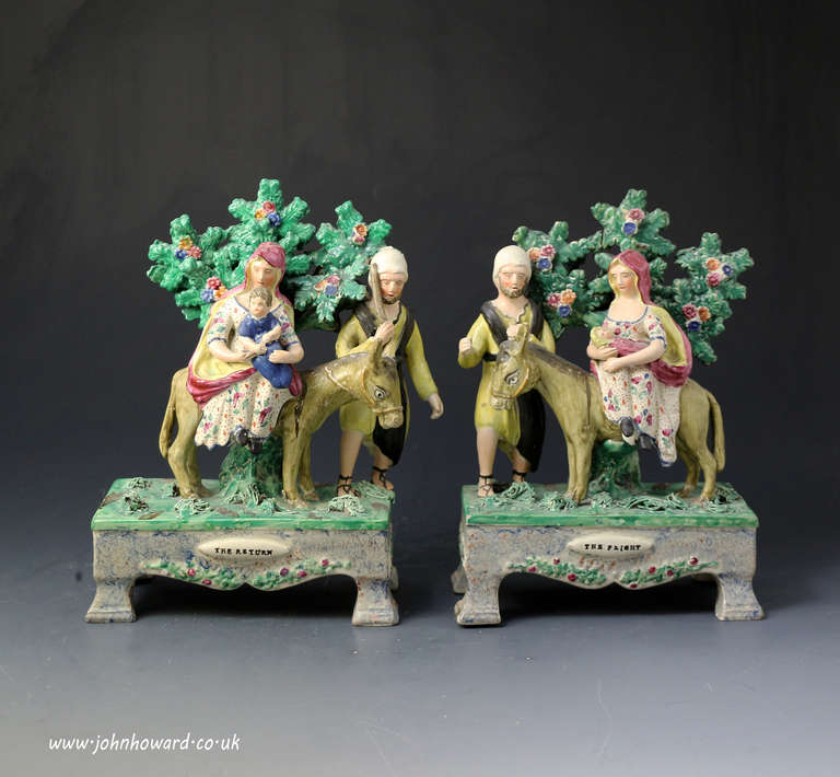 Antique Staffordshire pottery pearlware table base figures of the Flight and Return early 19th century 

A rare pair of table base pearlware figures depicting the Flight and Return from and to Egypt. Table bases figures are attributed to Obadiah