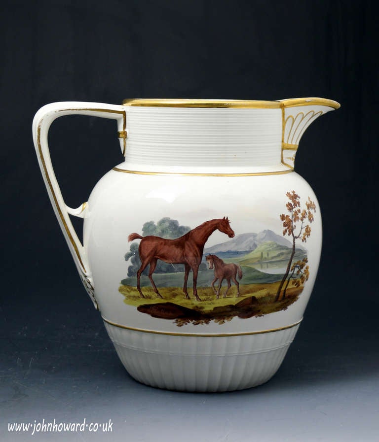 Antique English pottery pitcher with hand panted scenes of horse and foal and a farm by in rural setting. Early 19thc 

A very fine quality antique English pottery pitcher. The piece has two wonderfully hand painted decorated panels, one with