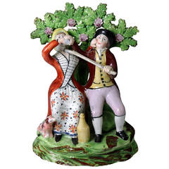 Staffordshire Pottery Figure Group of a "Drinking Couple"