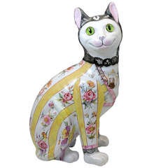 Galle pottery figure of a comical cat with glass eyes. c1900