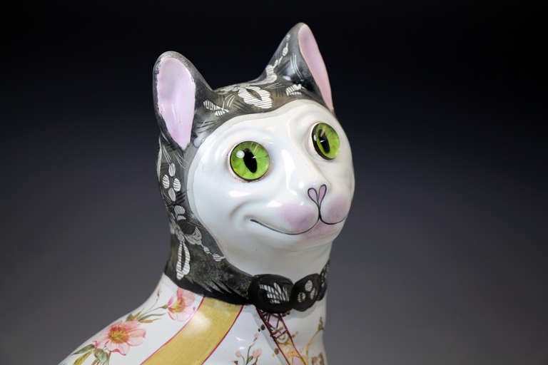 Galle pottery figure of a comical cat with glass eyes. c1900 1