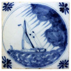 English Delftware blue and white tile with ship in a storm 18th century